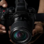 the panasonic s5 ii being held by two hands 1